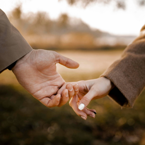 Couple holding hands